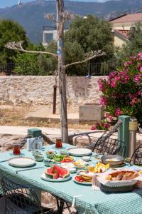 a blue table with plates of food on it at Lacitrus Hotel & Villa in Kaş