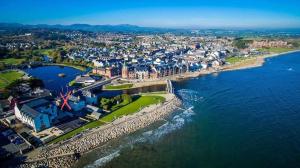 an aerial view of a city next to the water at Castle Place in Newcastle