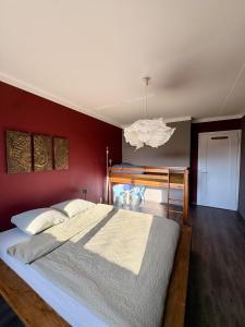 a bedroom with a large bed and a desk at Pepper House in La Chaux-de-Fonds +4 photos