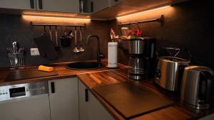 a kitchen with a sink and a counter top at Apartment Baltica in Rostock