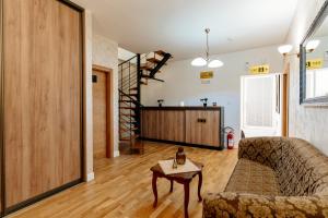 a living room with a couch and a table at Bofima Apartments in Kotor +229 photos