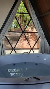 a view of a window in a tent at Cabana Quintal in Aquidauana