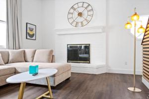 a living room with a couch and a fireplace at Nookside Grand Estate For 8 in Hamilton