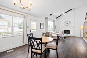 a living room with a table and chairs and a couch at Nookside Grand Estate For 8 in Hamilton +52 photos