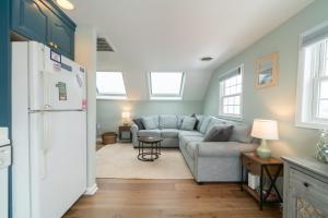 a living room with a couch and a refrigerator at Ocean City 2BR Condo in Ocean City +18 photos