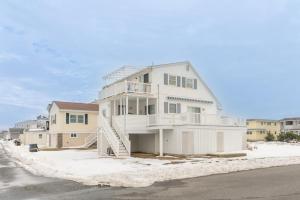 a large white house on the side of a street at Ocean City 2BR Condo in Ocean City
