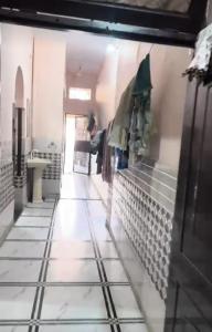 a person standing in a room with a figurine on the wall at Khanna Nagar GDA approved colony in Ghaziabad