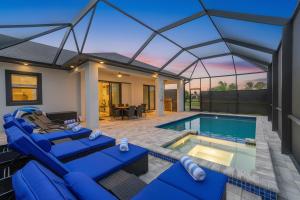 a home with a swimming pool and a house at Upscale Getaway in Rotunda-West