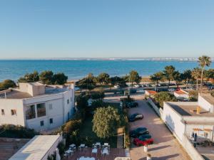 an aerial view of a parking lot next to the ocean at SHAH Rooms&relax in Taranto