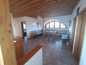 a large living room with a table and chairs at Kolonics Pincészet Vendégház Somló in Somlóvásárhely +7 photos