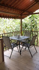 a table and two chairs on a patio at Nature retreat in Río Cuarto +15 photos