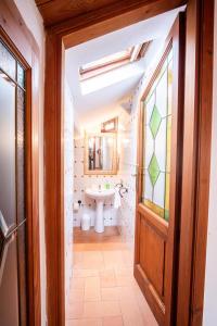 a bathroom with a sink and a toilet and a window at Chiama Ride the Beauty Assisi in Assisi +84 photos