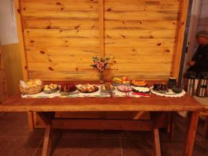 a table filled with different types of food on it at Pousada Zacarias in Ouro Preto