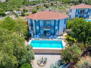 an aerial view of a house with a swimming pool at Lacitrus Hotel & Villa in Kaş