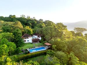 an aerial view of a house in the forest at Kandy Knightsdale Villa in Panwila