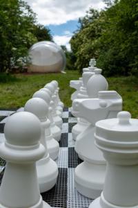 a row of white containers sitting on top of a table at Grand bubble in Kent +9 photos
