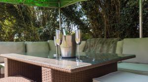 a table with wine glasses on top of it at Grand bubble in Kent