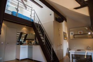 a loft conversion with a spiral staircase in a room at Loft Altavista in Talloires