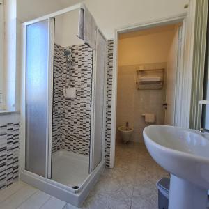 a bathroom with a shower and a sink at Hotel Giardino del Sole in Savona +51 photos