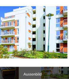 two pictures of a apartment building and a street light at Nordsee Resort in Wangerland