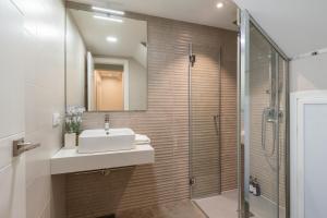 a bathroom with a sink and a shower at UNIQUE HOMES LAS SETAS LA CAMPANA in Seville +21 photos