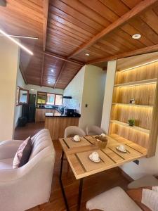 a living room with a table and a couch at Casa del abuelo Lodge in Cajamarca