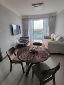 a living room with a table and a couch at Haven Place 254-near JKIA,SGR with Self-Check in & Free Parking in Nairobi