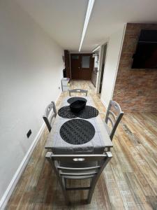 a dining room table with chairs and a bowl on it at Mini Suite Apartment 2 in Castel di Sangro