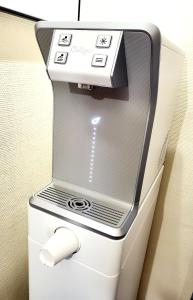 a white refrigerator with a paper roll in it at Atlantic Hôtel in Pau