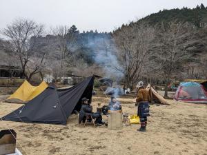 a group of people sitting around a tent at Fes nature in Fez
