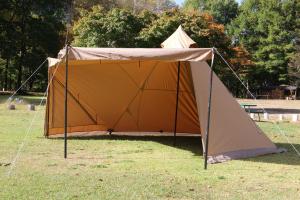 a large tent in the grass in a park at Fes nature in Fez