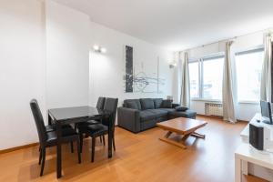 a living room with a couch and a table at Pescara Centro sul Mare in Pescara