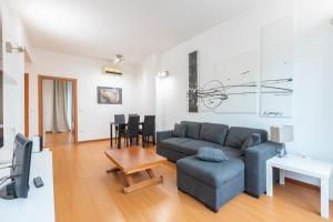 a living room with a couch and a table at Pescara Centro sul Mare in Pescara