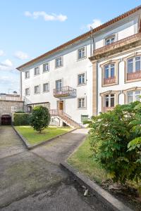 a large white building with balconies on it at Vale do Vez in Arcos de Valdevez