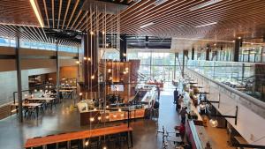 a large room with tables and chairs in a building at The Simon at Simon Fraser University in Burnaby