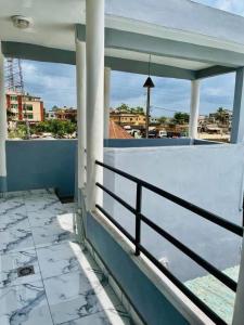 a balcony of a house with a view of a city at Résidence GOUDJA 2 in Cotonou