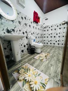a bathroom with a sink and a toilet at Mount View Plaza - Ella Cottage with Mountain &Valley View in Ella