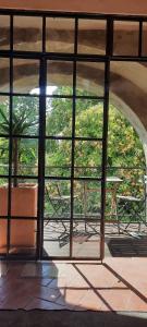 a window in a building with a view of a table at A Toca, Complete townhouse apartment in Monchique