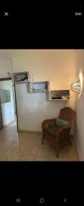 a room with a couch and a shelf on the wall at Évasion Naturelle in Grand-Baie