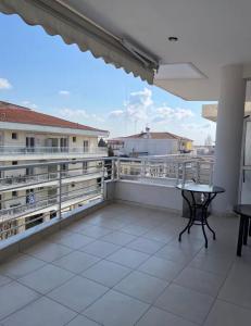 a balcony with a table and a view at Zoes apartments in Orestiada