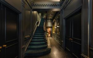 a staircase in a building with blue steps at The William Hotel Midtown, New York in New York