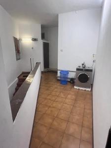 an empty kitchen with a sink and a washing machine at Tourist Rendez Vous Hotel in Plaine Magnien +16 photos