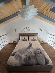 a bedroom with a bed with a giant koala on it at marinella house 2 in Sarzana