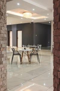 a dining room with a table and chairs at Blueroof BYO in Bulawayo