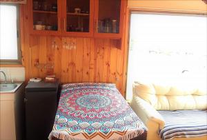 a kitchen with a table in the corner of a room at Cabaña a pasos del mar in El Cerrillo