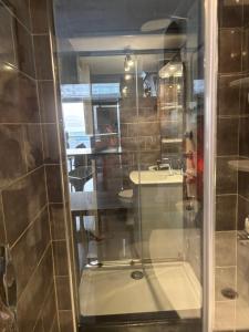 a bathroom with a shower and a sink at Sunset in Cap d'Agde