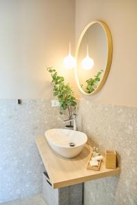 a bathroom with a sink and a mirror at Room45 in Marzamemi +46 photos