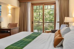 a bedroom with a bed and a large window at 2038 Warm Winter Retreat - Perfect Lodge Room in Cle Elum