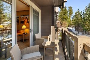 a porch with chairs and a table on a balcony at 2038 Warm Winter Retreat - Perfect Lodge Room in Cle Elum