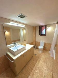 a bathroom with a sink and a toilet at Olea House in Elia Laconias +16 photos